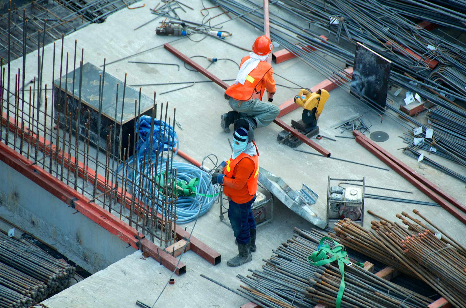 Construction workers and materials at a building site